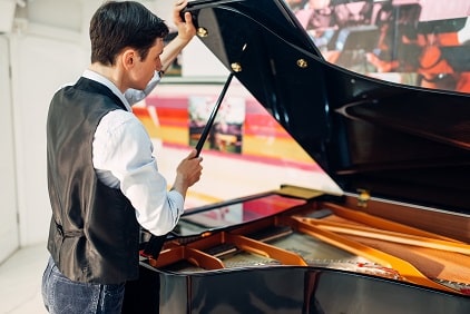 tuner at the piano